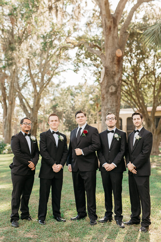 groomsmen on the green at mission inn resort wedding