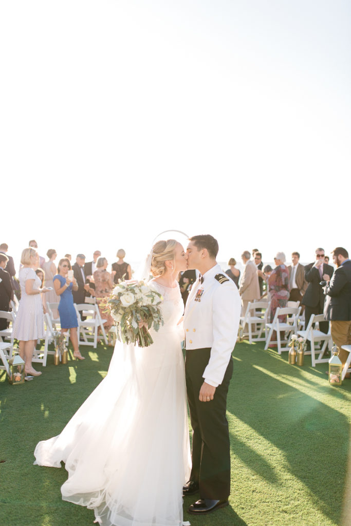 bride and groom first kiss at boca bay pass club wedding