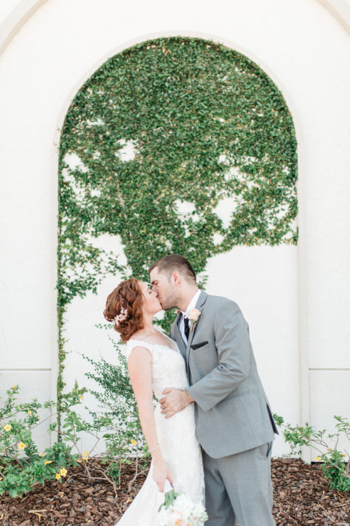 bride and groom ivy wall