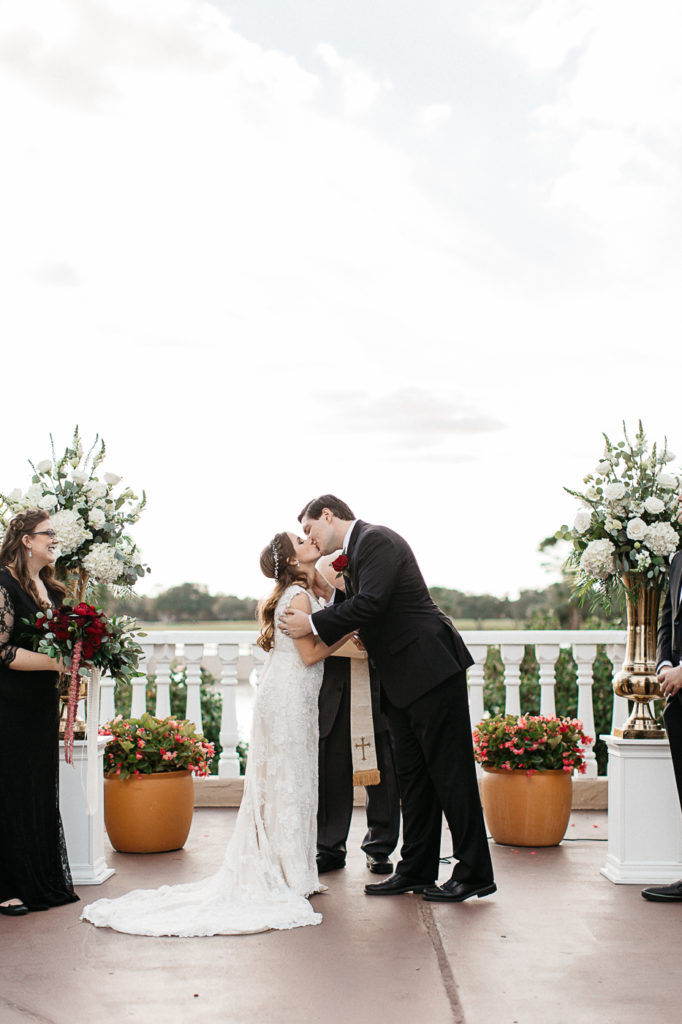 bride and grooms first kiss at their mission inn resort wedding