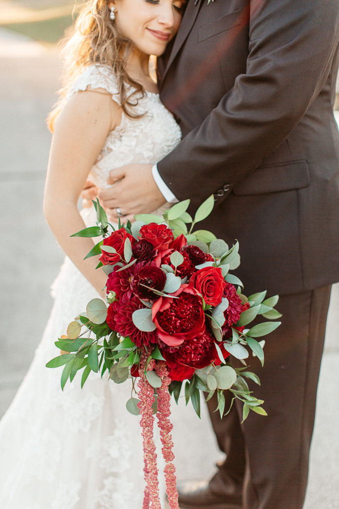 bride and groom romantic photos at mission inn resort wedding maroon bouquet