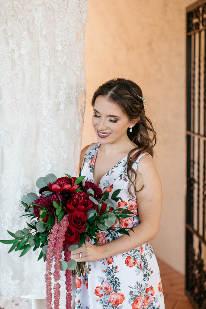 Blushing Bride with Maroon Florals at Mission inn Wedding