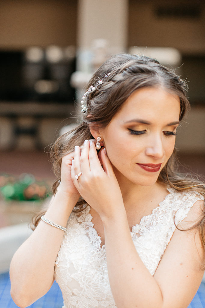 brides final details earrings portrait at Mission Inn resort wedding