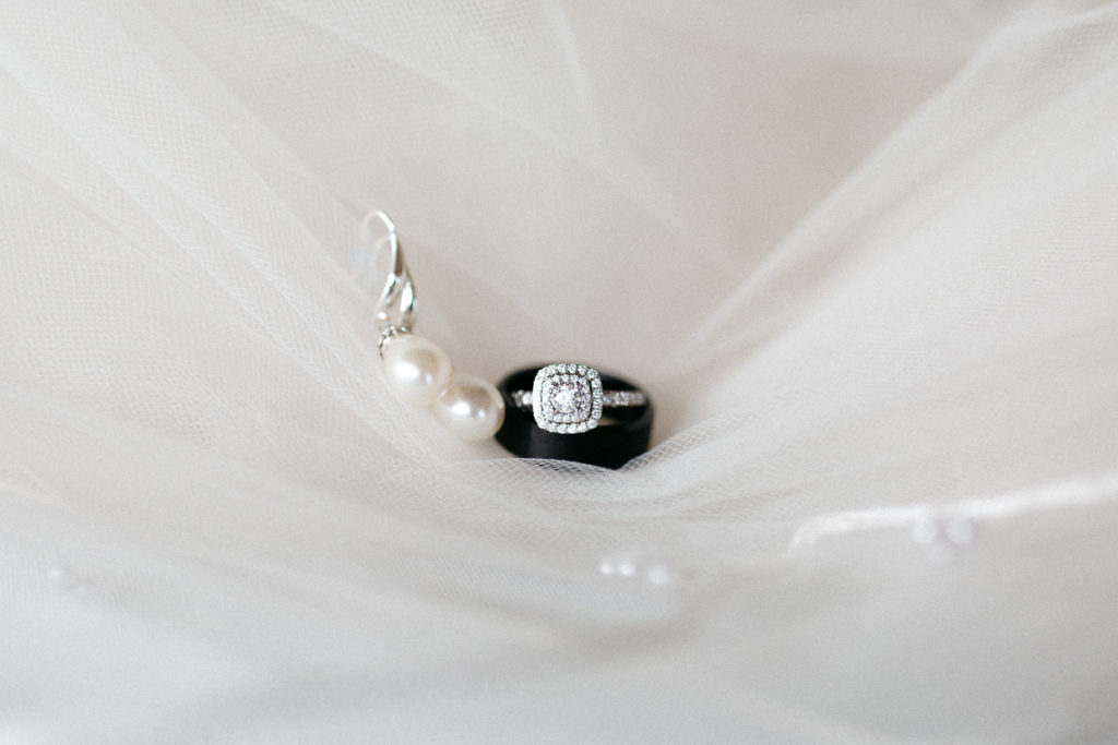engagement ring and grooms ring details on mothers veil golden bear club wedding