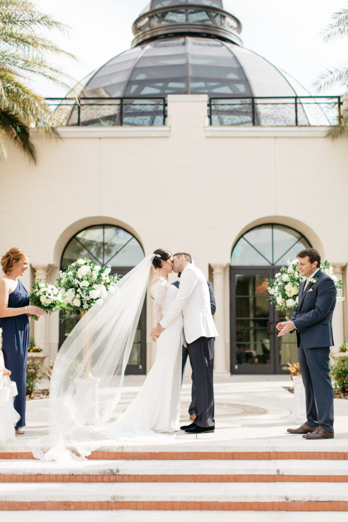 bride and groom first kiss at their alfond inn wedding ceremony