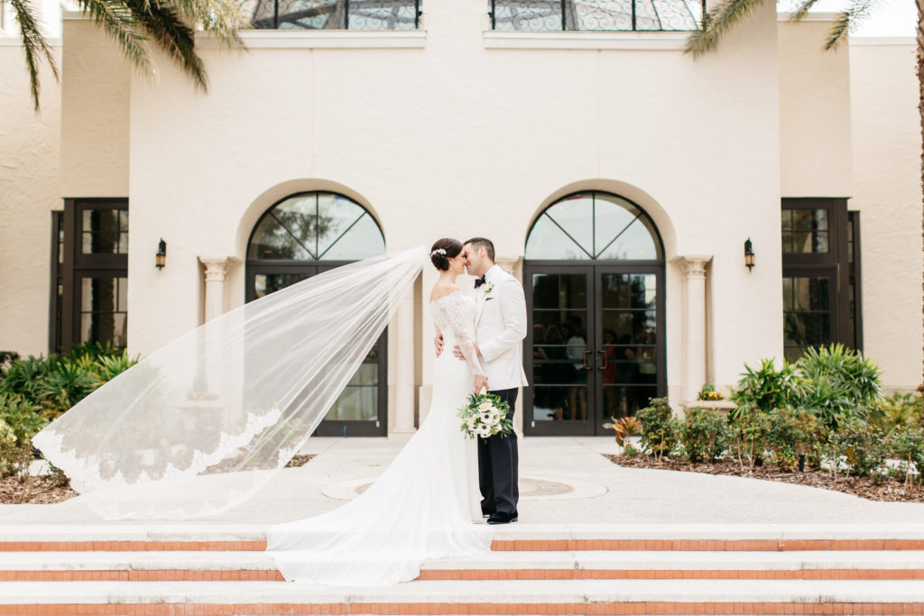 bride and groom with cathedral veil alfond inn wedding