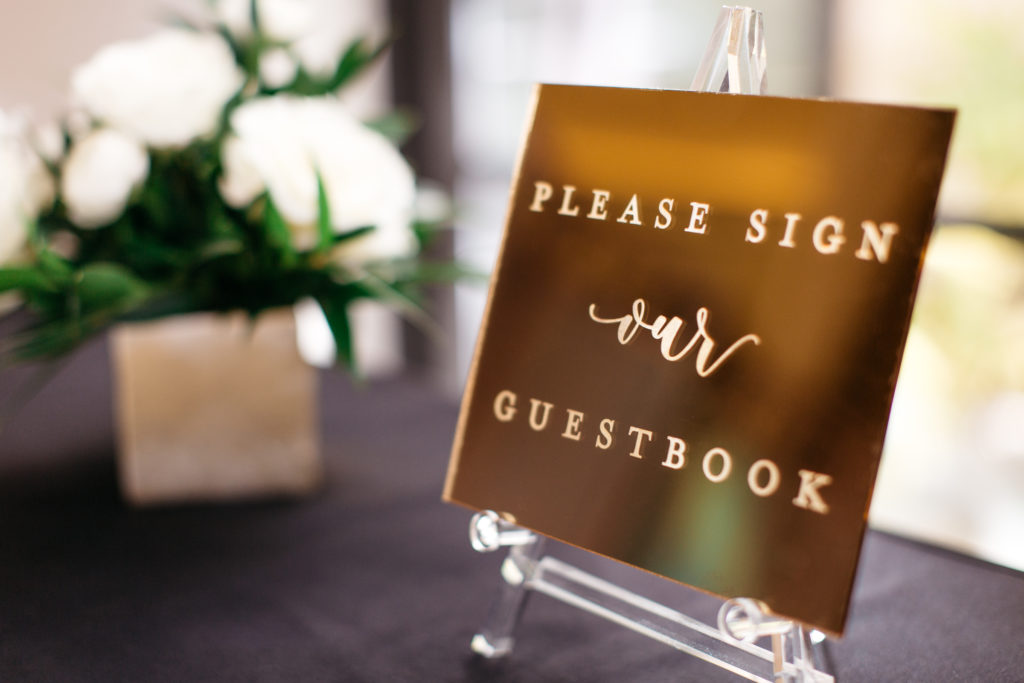 do tell calligraphy and design gold wedding guestbook sign