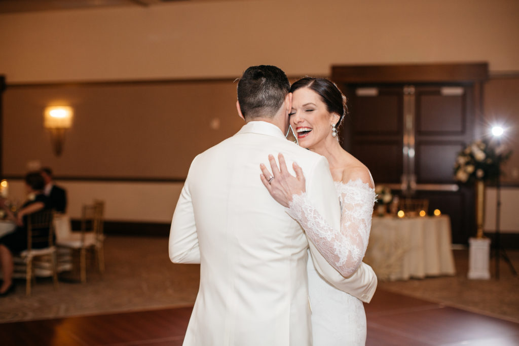 bride and groom share laugh during first dance at the alfond inn