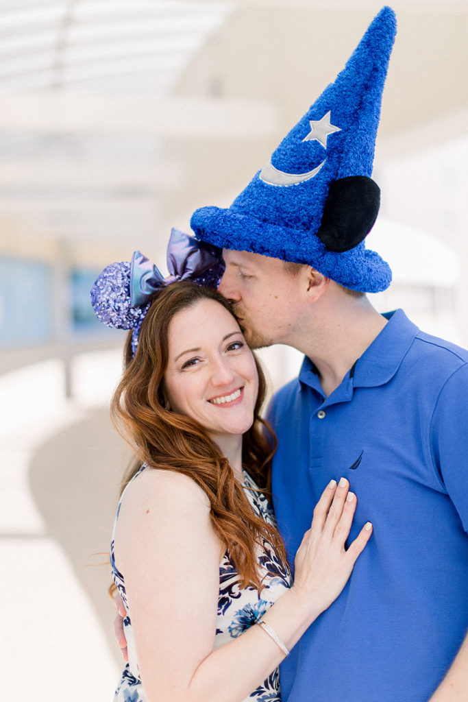 couple embrace at Disney's Contemporary resort for engagement session photos
