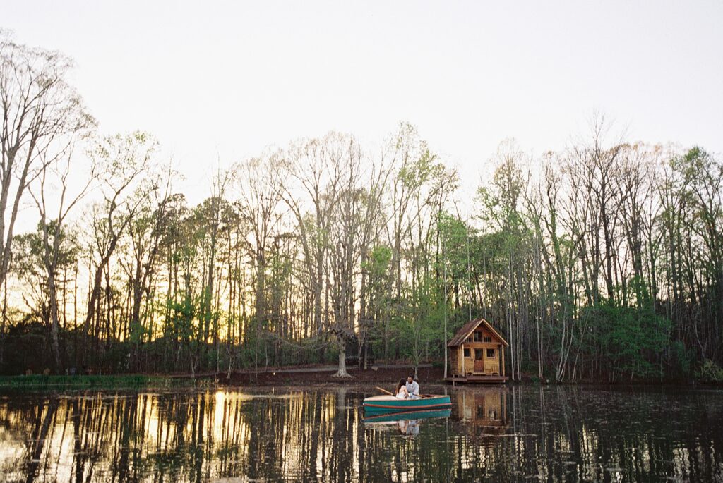 Bride and groom sunset portraits in row boat at their Kinsleeshop Farm Wedding, captured by North Carolina Wedding Photographer, Casie Marie Photography