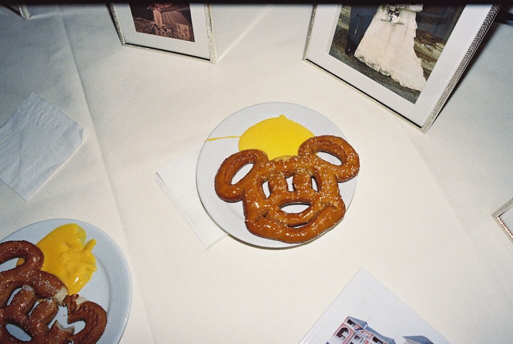 Mickey Pretzle with cheese during wedding reception at The Attic in Disney’s Boardwalk Resort photographed by Casie Marie Photography