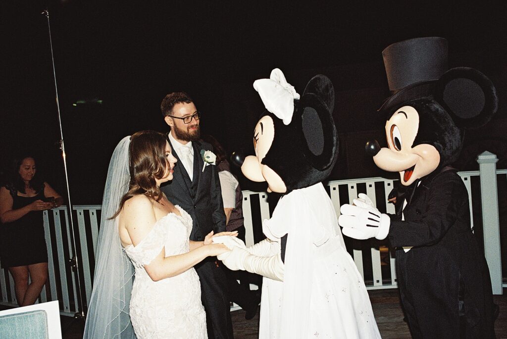 Candid photos during wedding reception at The Attic in Disney’s Boardwalk Resort photographed by Casie Marie Photography