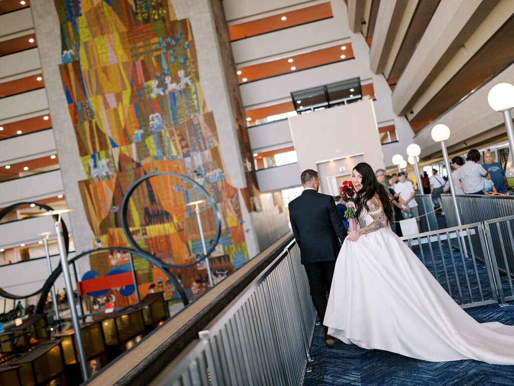 Bride and Groom photos on the monorail to their reception captured by Walt Disney World wedding photographer Casie Marie Photography