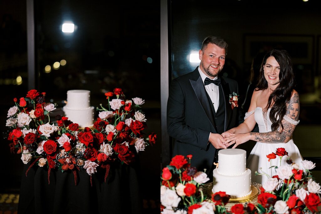 Bride and groom cutting their cake surrounded by flowers at Disneys Contemporary resort Napa Room, photographed by Walt Disney World wedding photographer Casie Marie Photography