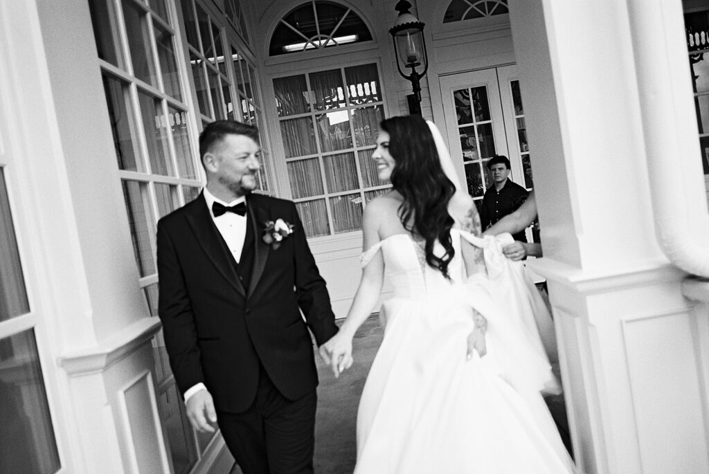 Bride and groom candid portraits at Disney’s Grand Floridian captured by Walt Disney World wedding photographer Casie Marie Photography