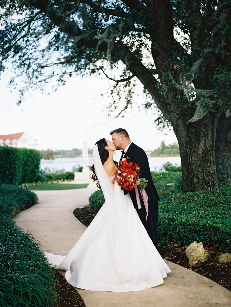 Bride and groom together at Picture Point at Disneys Wedding Pavilion captured by Walt Disney World wedding photographer Casie Marie Photography