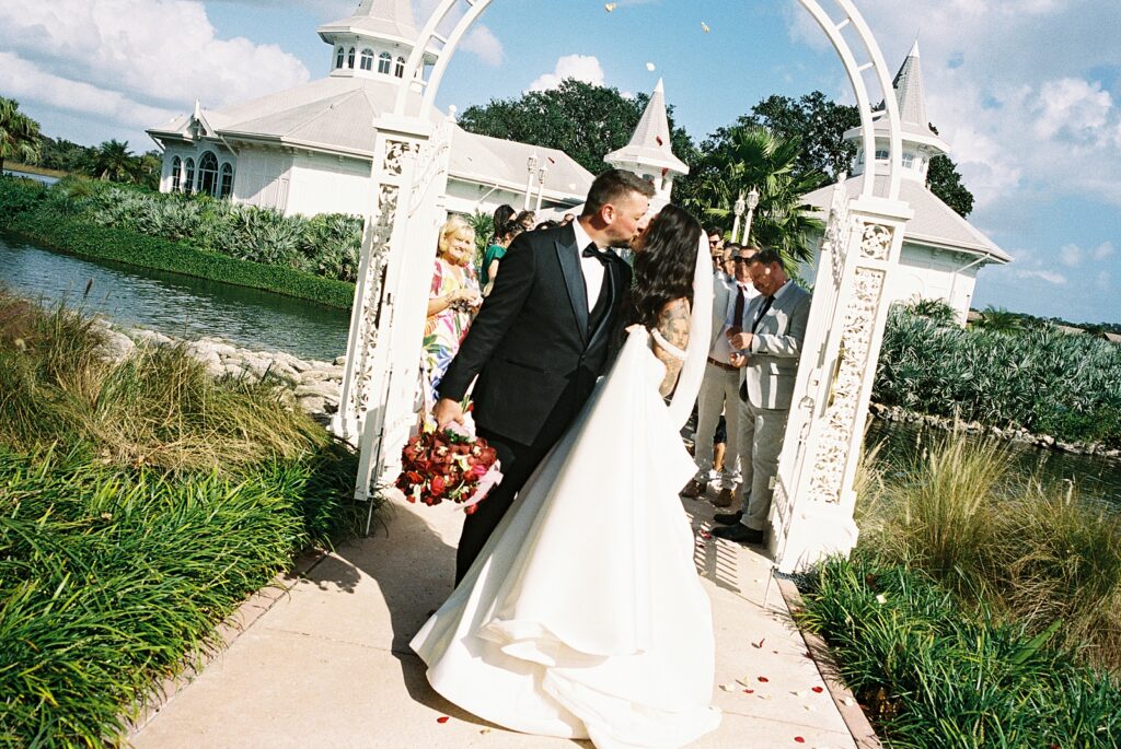Candid petal toss photos at Disneys Wedding Pavilion captured by Walt Disney World wedding photographer Casie Marie Photography
