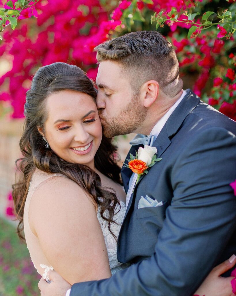 bride and groom kissing in march of 2020