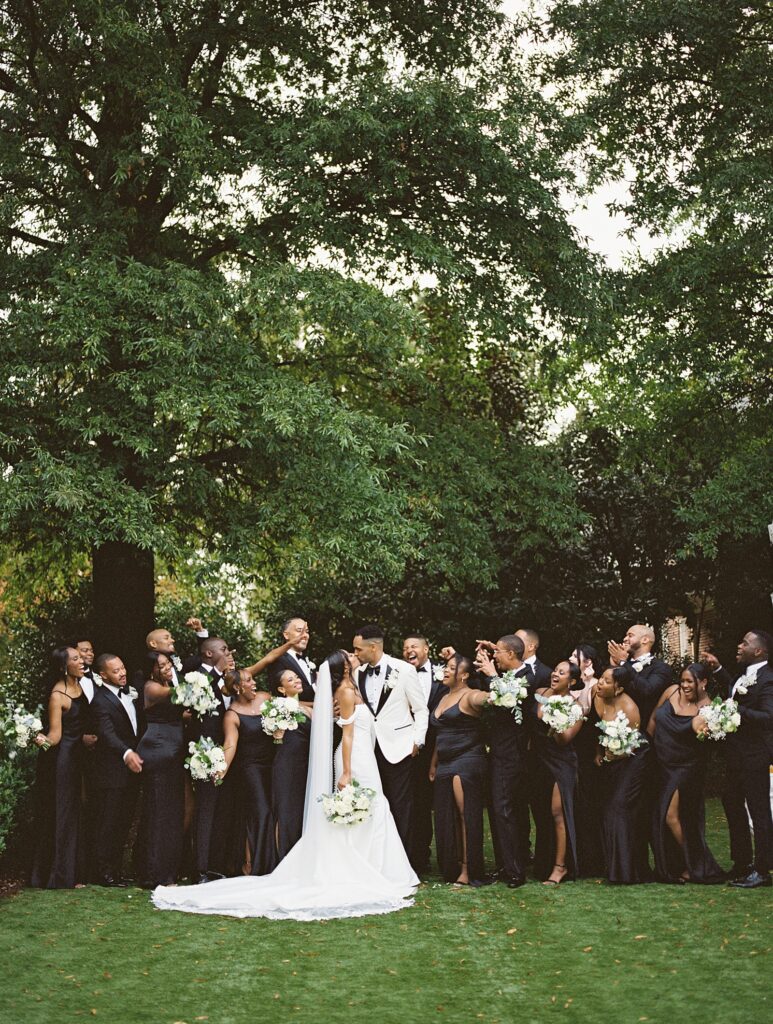 wedding party on the back yard at Merrimon-Wynne house wedding photographed by Casie Marie Photography